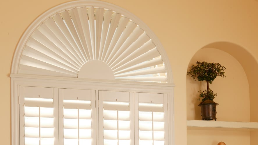 Casement window with white window shades